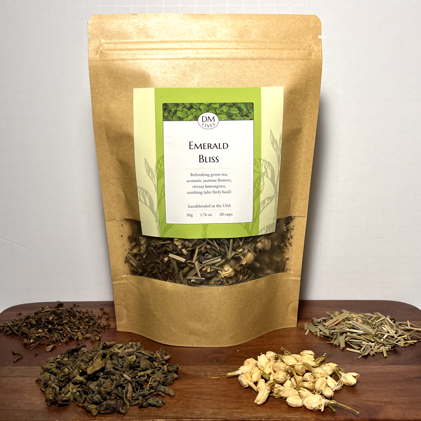 Emerald Bliss front packaging – Elegant design showcasing the green tea blend with jasmine flowers, lemongrass, and tulsi for a refreshing experience.
